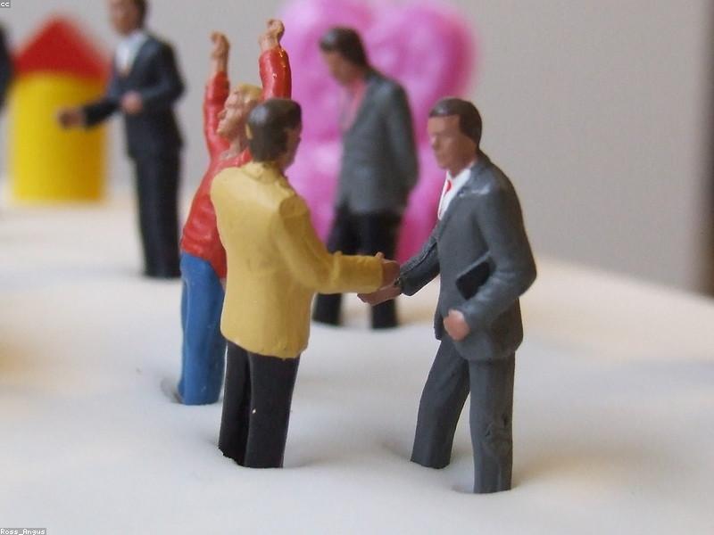 Business partnership handshake